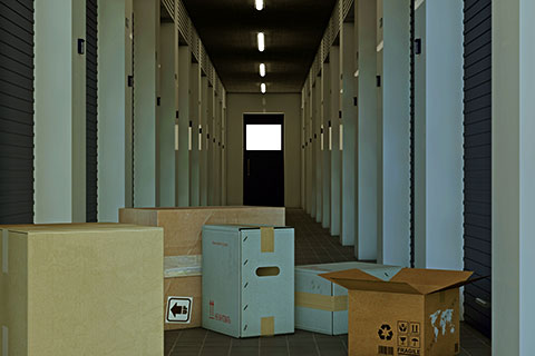Interior storage units with boxes on the hallway floor.